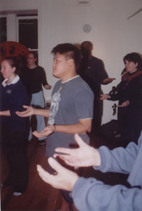a group of people practicing fragrant qigong techniques